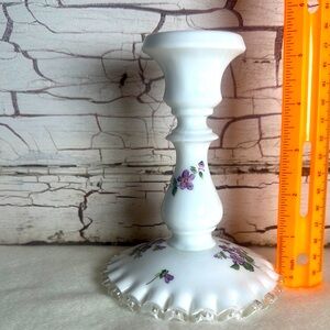 Vintage violet Fenton candlestick holder with purple flowers.